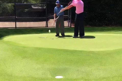 AI Video from prompt: Guy makes a hole in one