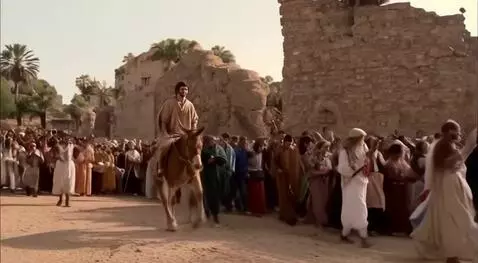 AI Video from prompt: Realistic video showing Jesus riding on a donkey