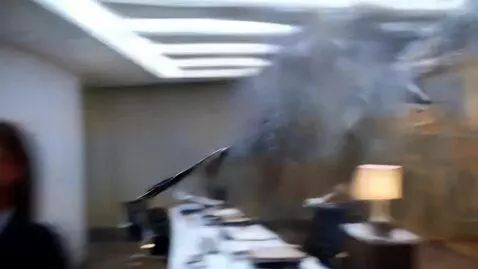 AI Video from prompt: Office. A woman tears the hands off a wall clock