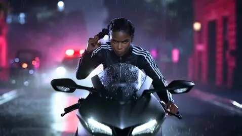 AI Video from prompt: Scene: Urban night city street, heavy rain, wet 