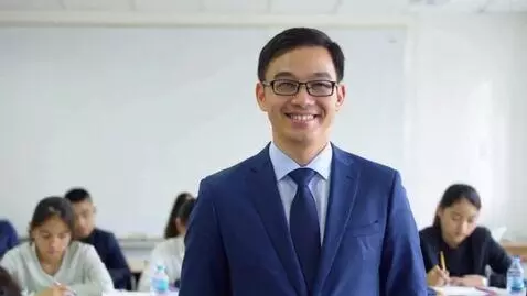 AI Video from prompt: A calm male professor, wearing glasses and a blu