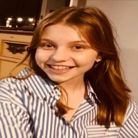 AI Video from prompt: The girl rides on a violet electo scooter on the