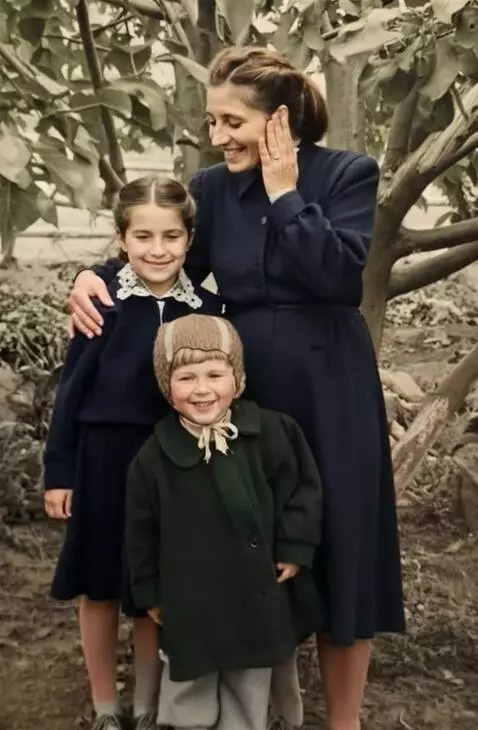 AI Video from prompt: The mother hugs her daughters, whispers somethin