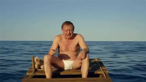 AI Video from prompt: зеленский в трусах на плоту в океане и громко ры