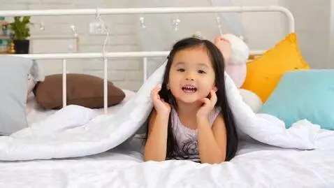 AI Video from prompt: cute little woman lying on her bed shows