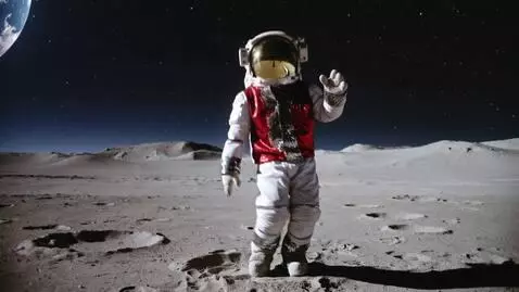 AI Video from prompt: An astronaut with silver sequin gloves and a red