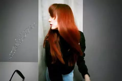 AI Video from prompt: A girl violently shakes her head and long hair b