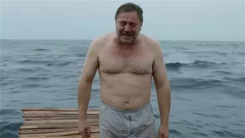 AI Video from prompt: Зеленский стоит в трусах в клеточку на плоту в о