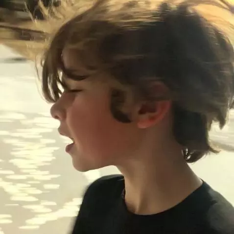 AI Video from prompt: He runs along the seashore in swimming trunks.