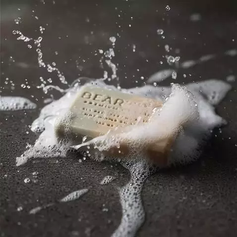 AI Video from prompt: Dynamic macro shot, water splashes on a bar of s