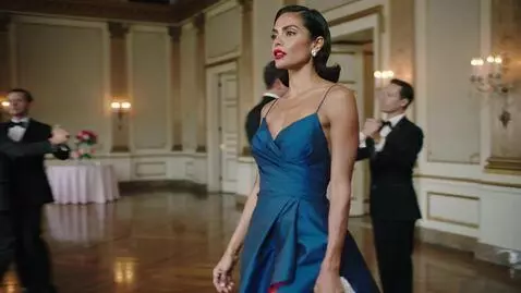 AI Video from prompt: A glamorous dark haired woman with  red lips and