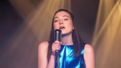 AI Video from prompt: Wide-angle animation of a young woman performing