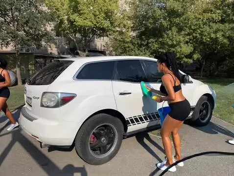 AI Video from prompt: The sexy girls are washing the car.