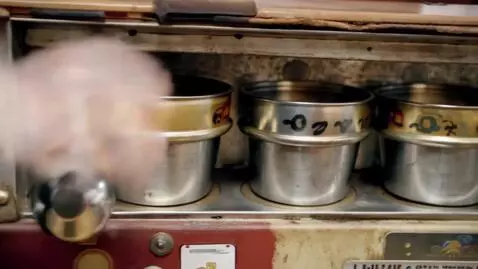 AI Video from prompt: [SHOT 1: CLOSE-UP] The player's hand holding a c