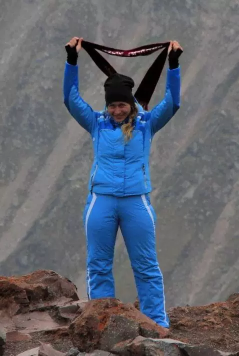 AI Video from prompt: The girl lifts up a scarf with the inscription "