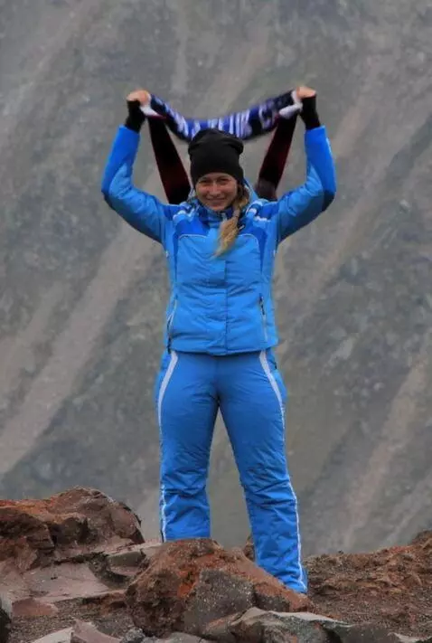 AI Video from prompt: The girl lifts up a scarf with the inscription "