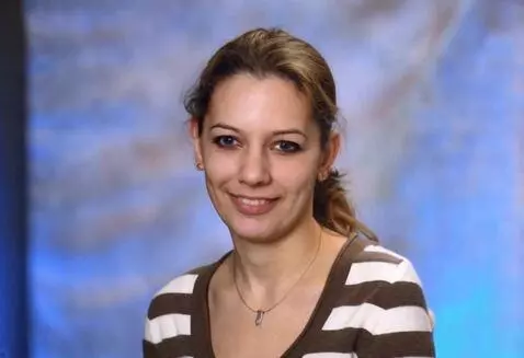 AI Video from prompt: The person should stand up and wear a short skir