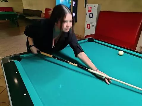 AI Video from prompt: The girl hits the ball with a cue. The girl gets