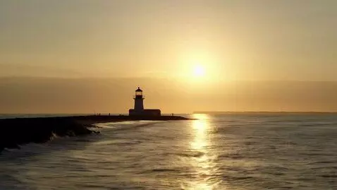 AI Video from prompt: A cinematic video begins with a lighthouse stand