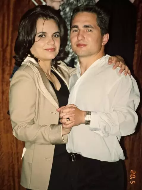 AI Video from prompt: The man and the woman continue to look at the ca