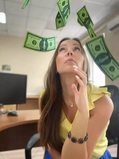 AI Video from prompt: A lot of dollar bills fall on the girl from abov