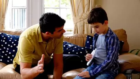 AI Video from prompt: stern man admonishing teenage boy