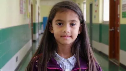 AI Video from prompt: 16-year-old girl standing in the middle school. 