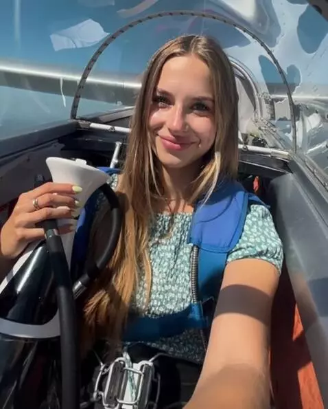 AI Video from prompt: The girl slowly approaches the camera, smiles te