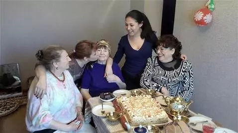 AI Video from prompt: целуют и поздравляют бабулю с днем рождения