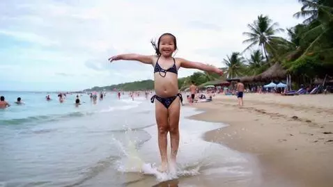 AI Video from prompt: asian girl  jumping on the beach