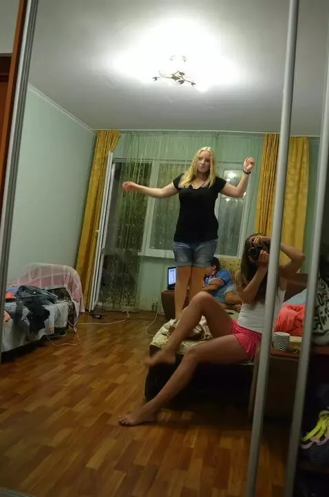 AI Video from prompt: Girl with camera put  her feet on sofa