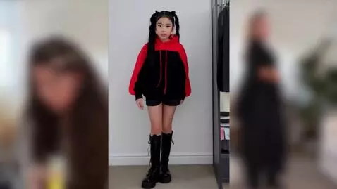 AI Video from prompt: A girl with two ponytails and black hair, wearin