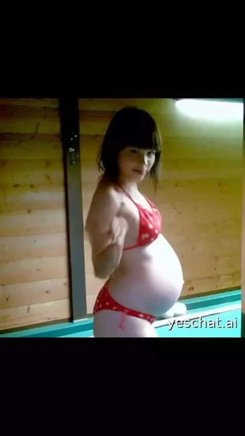 AI Video from prompt: A girl strokes her belly, a girl smiles and look