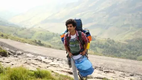 AI Video from prompt: Create a video of a Colombian guy traveling arou