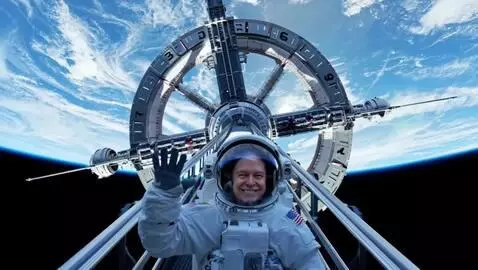 AI Video from prompt: The astronaut smiles and waves. The circular par