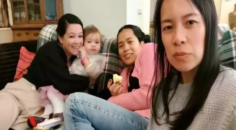 AI Video from prompt: Make them all laugh and tease the baby