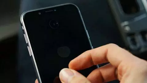 AI Video from prompt: The phone screen. Then the phone turns and a han