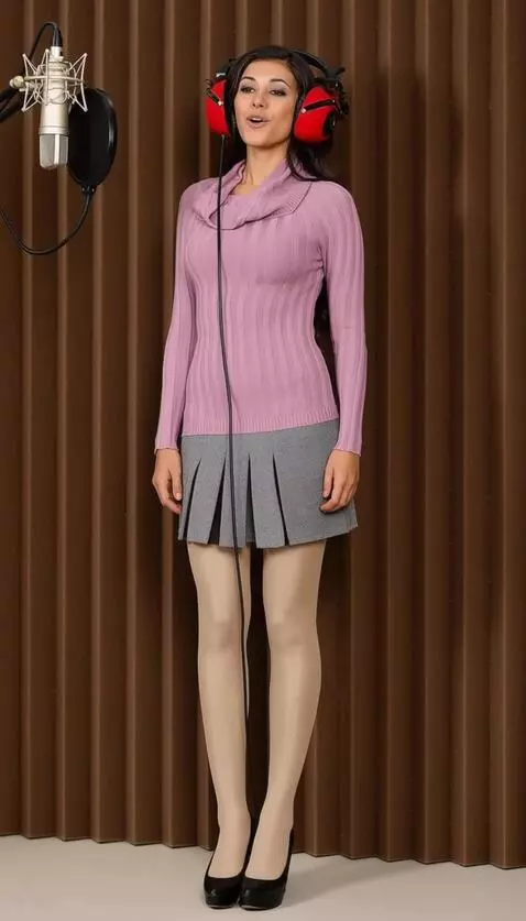 AI Video from prompt: A woman with headphones is singing. The camera f