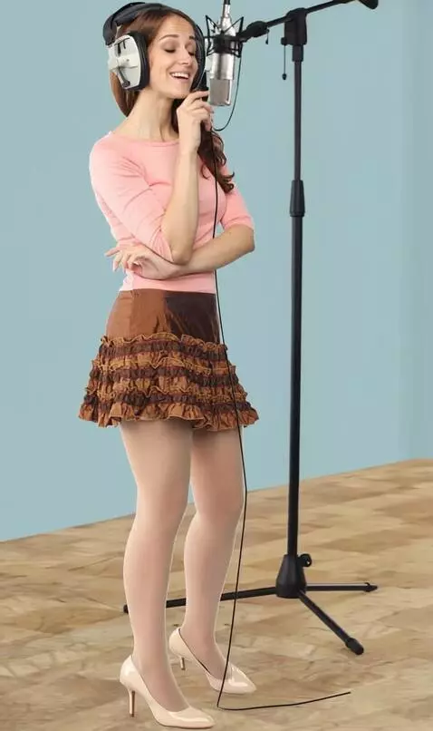 AI Video from prompt: A woman with headphones is singing. The camera f