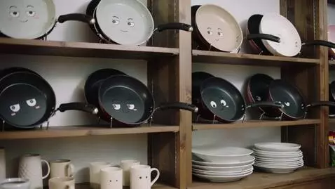 AI Video from prompt: Pans with cartoon faces, frying pans with cartoo