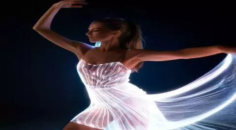 AI Video from prompt: The dancer spins with her leg raised high, and h