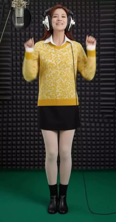 AI Video from prompt: A woman wearing headphones sings vigorously. The