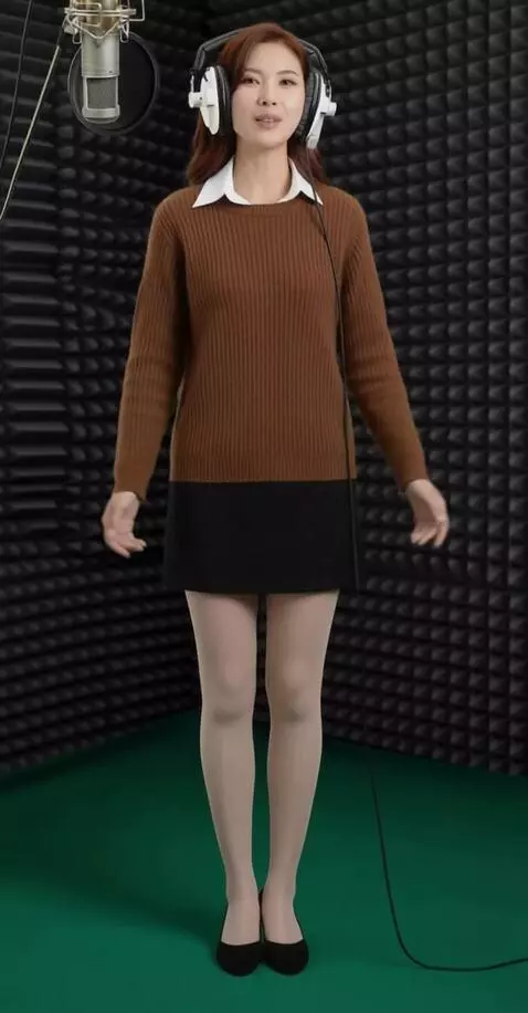 AI Video from prompt: A woman with headphones is singing. The camera f