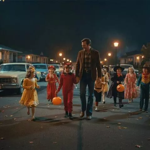 AI Video from prompt: A father and son are out on Halloween night surr