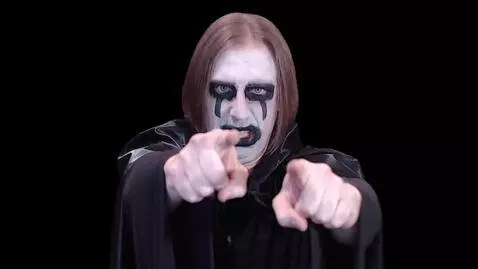 AI Video from prompt: A man in a black robe stands with corpse paint o