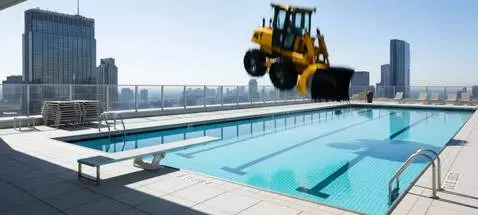 AI Video from prompt: С неба в бассейн падает бульдозер