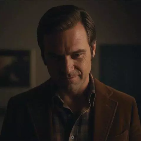 AI Video from prompt: Man looks towards the floor with a very sinister