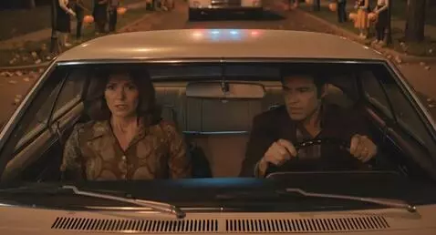 AI Video from prompt: Couple following an ambulance from behind in the