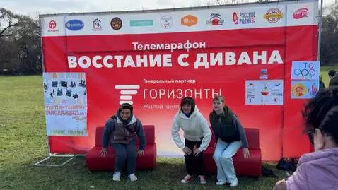 AI Video from prompt: The people sitting on the red sofas stand up abr