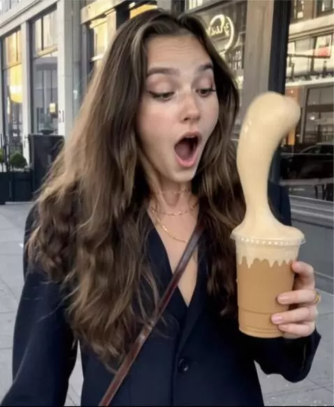 AI Video from prompt: The girl's drink quickly foams up, covering ever